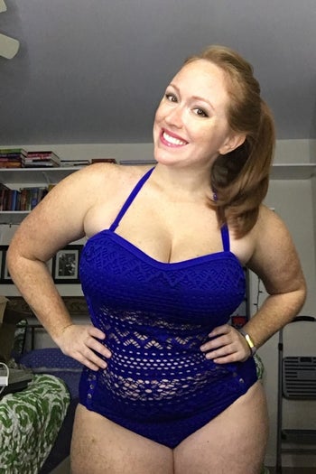 reviewer in the royal blue suit with straps in halter style and see through crochet torso