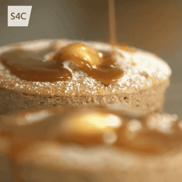 Caramel being poured onto a cake