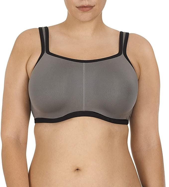 model wearing grey and black sports bra