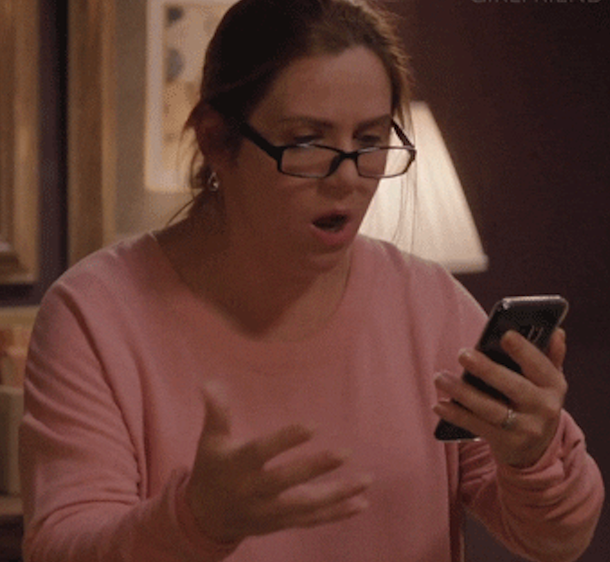 Woman checking a phone and gasping