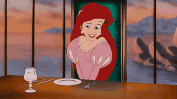 Ariel from &quot;The Little Mermaid&quot; grabbing a fork and smiling