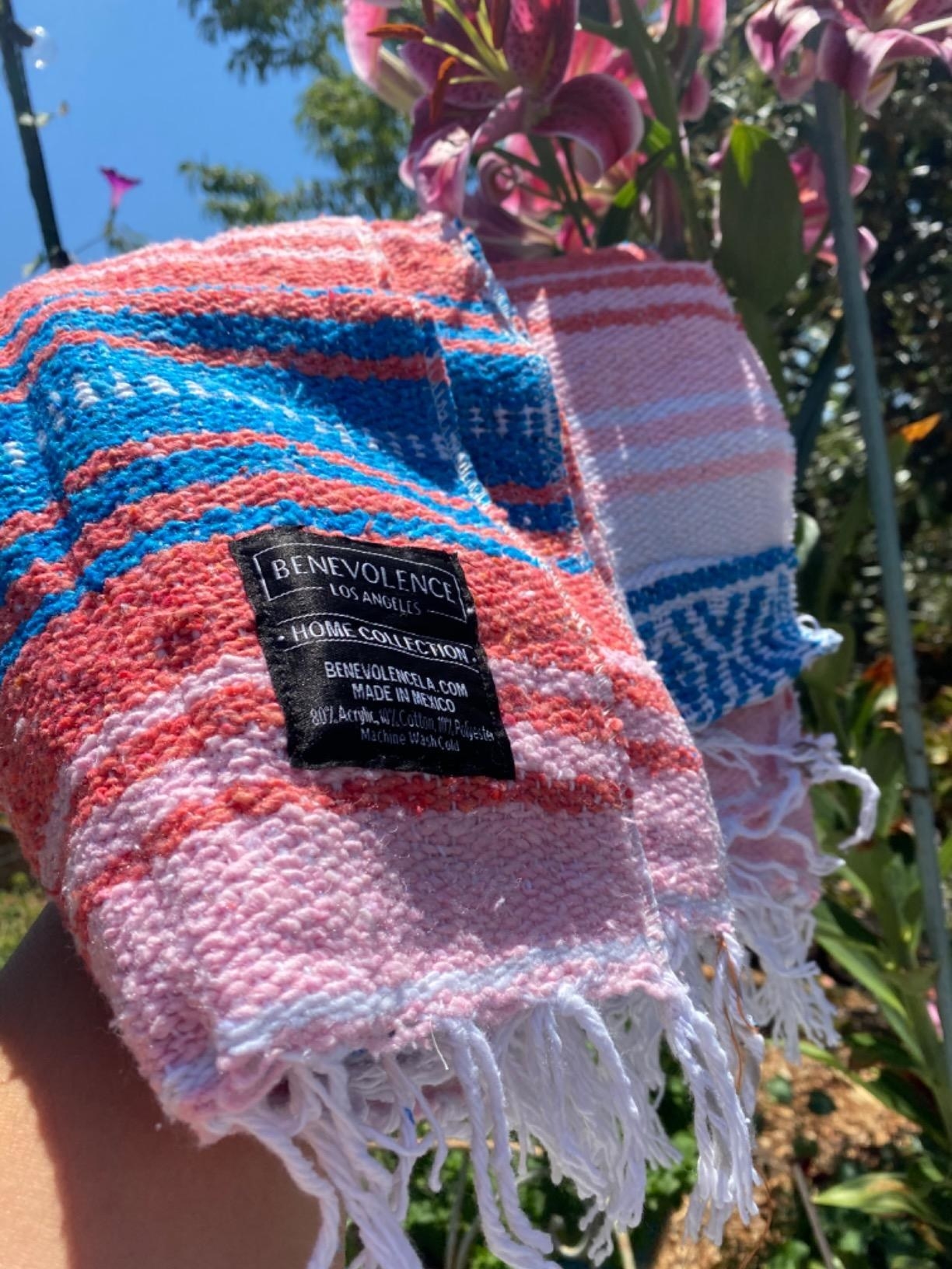 a striped red, blue, pink, and white blanket
