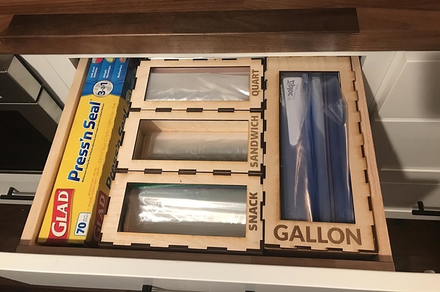 open kitchen drawer with sections for different sized plastic bags