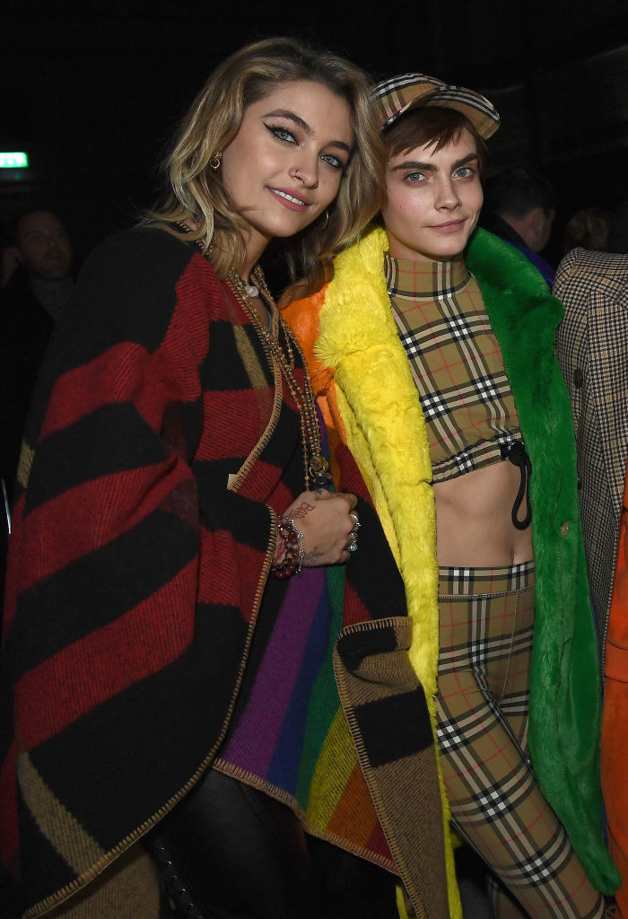 Paris Jackson (L) and Cara Delevingne wearing Burberry at the Burberry February 2018 show during London Fashion Week
