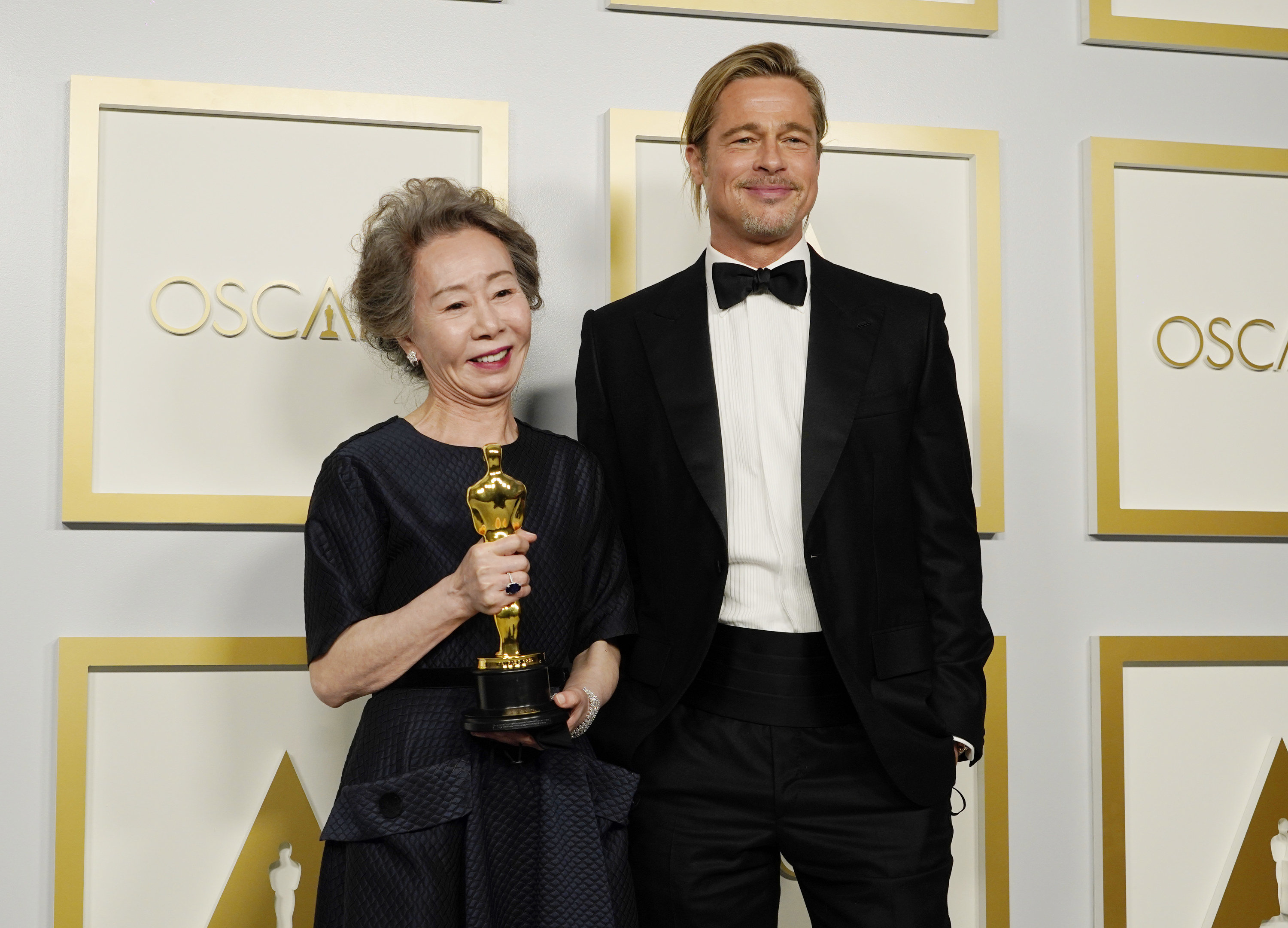 Yuh-Jung Youn and Brad Pitt backstage at the Oscars