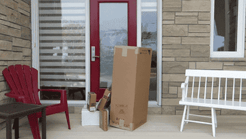 A man opening the door to packages