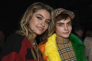 Paris Jackson (L) and Cara Delevingne wearing Burberry at the Burberry February 2018 show during London Fashion Week