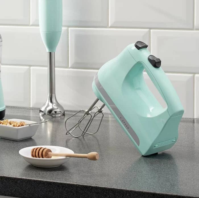 The five-speed hand mixer in ice blue with an imulsion attachment