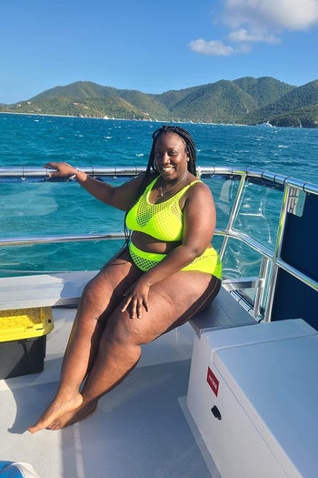 reviewer wearing the neon yellow bikini