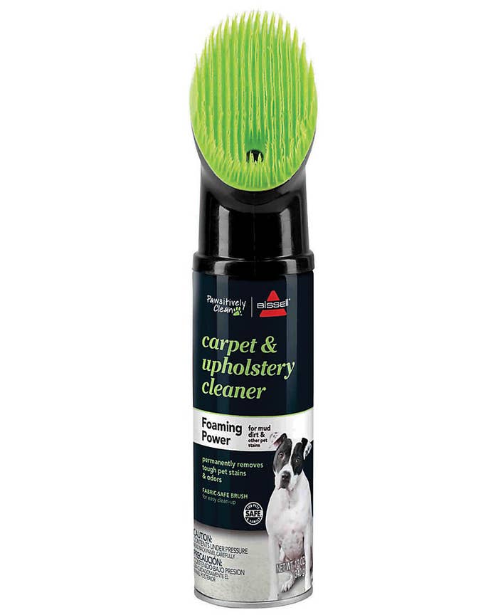 the black bottle which has a green silicone brush on top