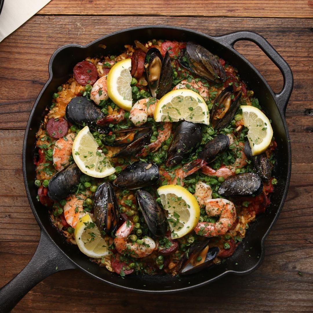 Cast Iron seafood paella with shrimp and mussels.