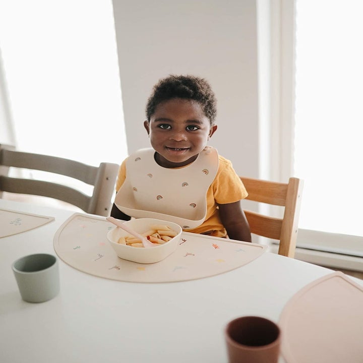 baby with matching placemat and bib