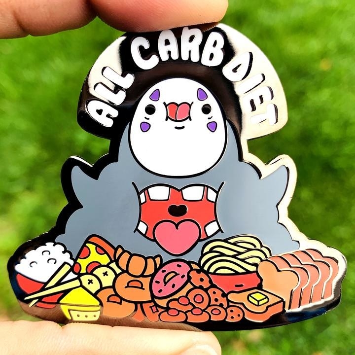 Pin of a cutesy version of No Face with his mouth open and surrounded by food like pizza, bread, donuts, and rice with the text &quot;All carb diet&quot;