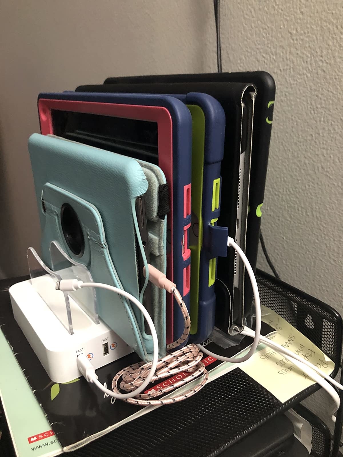 the charging dock filled with phones and tablets