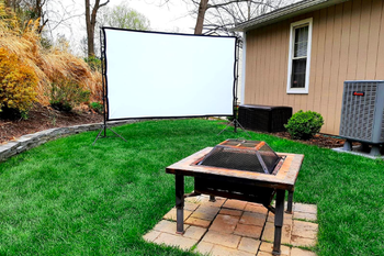 Reviewer's large screen hung in the backyard during the day 