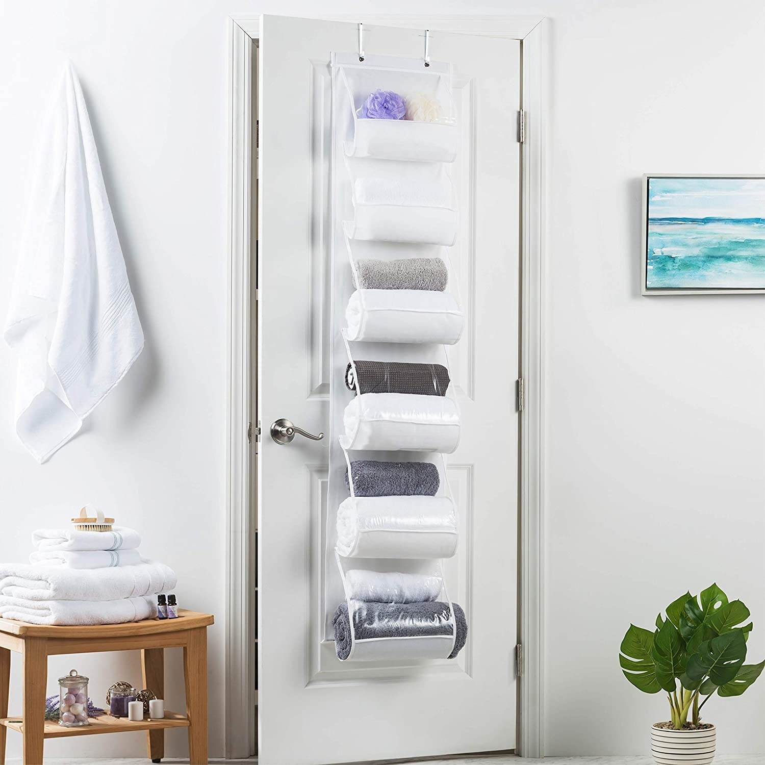 The filled towel organizer on a door