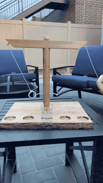 A gif of the wooden game being played