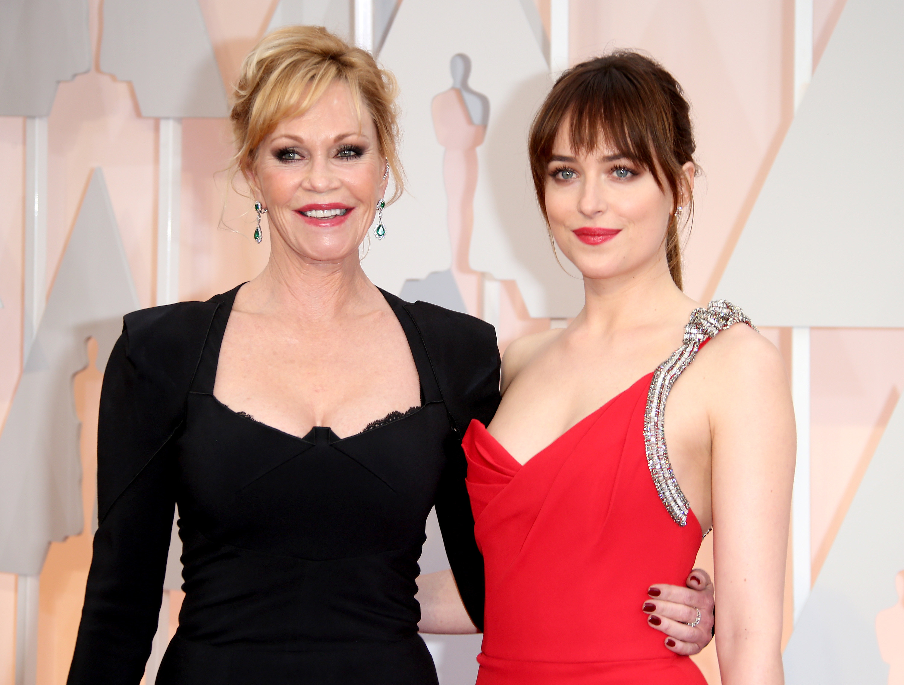 Melanie Griffith and Dakota Johnson in gowns on the red carpet