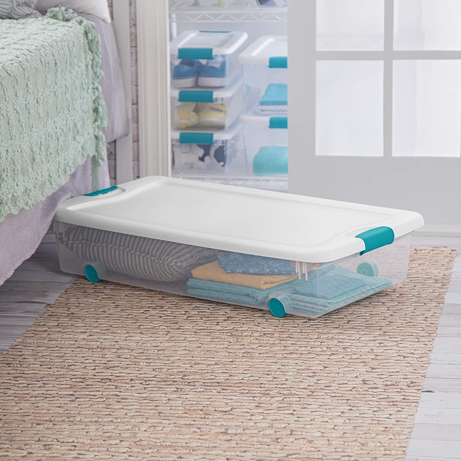 A rolling storage container with a lid in a bedroom