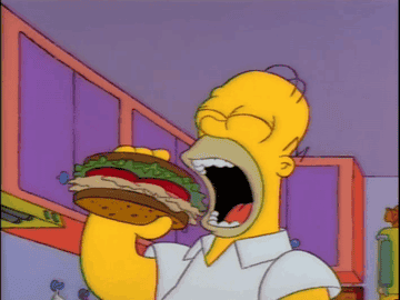 Homer Simpson eating a sandwich