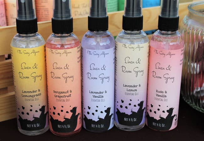 Five bottles of The Sassy Alpaca Linen and Room Spray in various scents