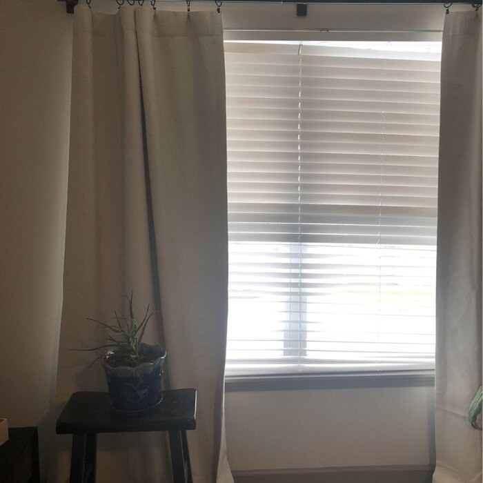 A reviewer photo of the curtains, which have rod pockets and can also be hung with hooks