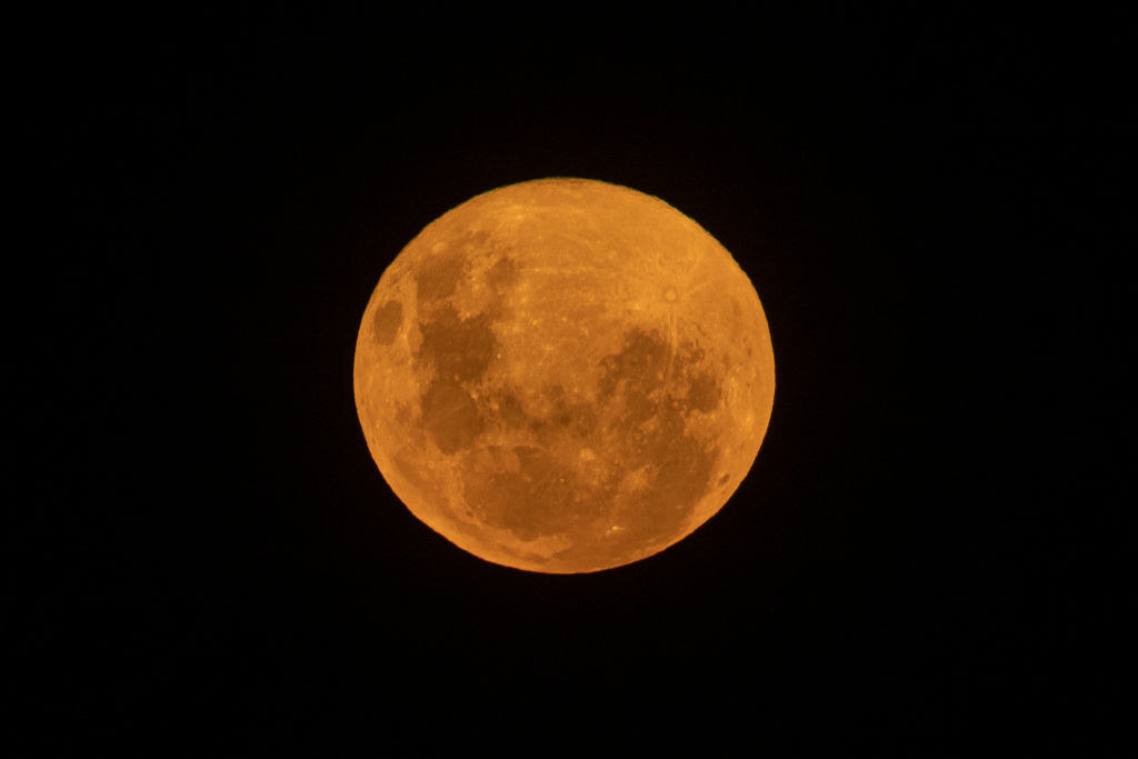 The pink super moon rises over Bondi Beach in Sydney, Australia.