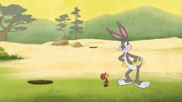 Screenshot of Bugs Bunny looking down on a tiny Elmer Fudd in a field 