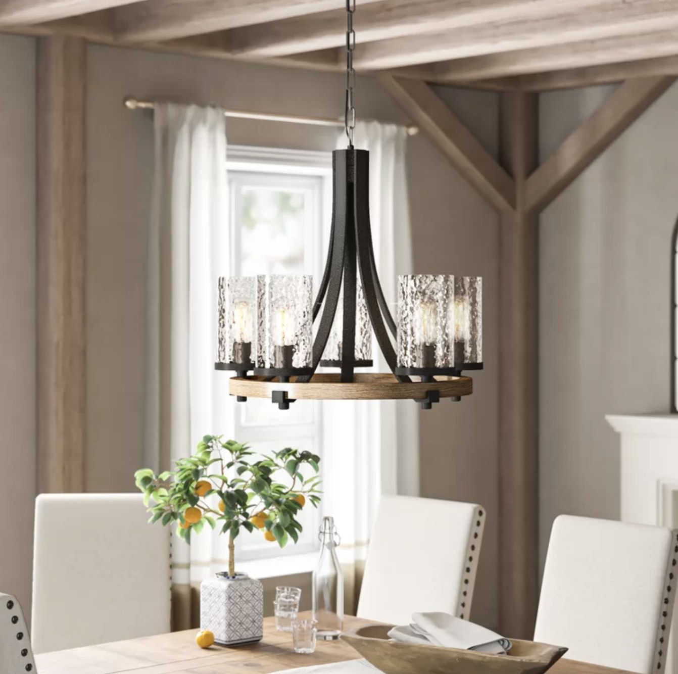 the chandelier with glass light shades and a wooden base