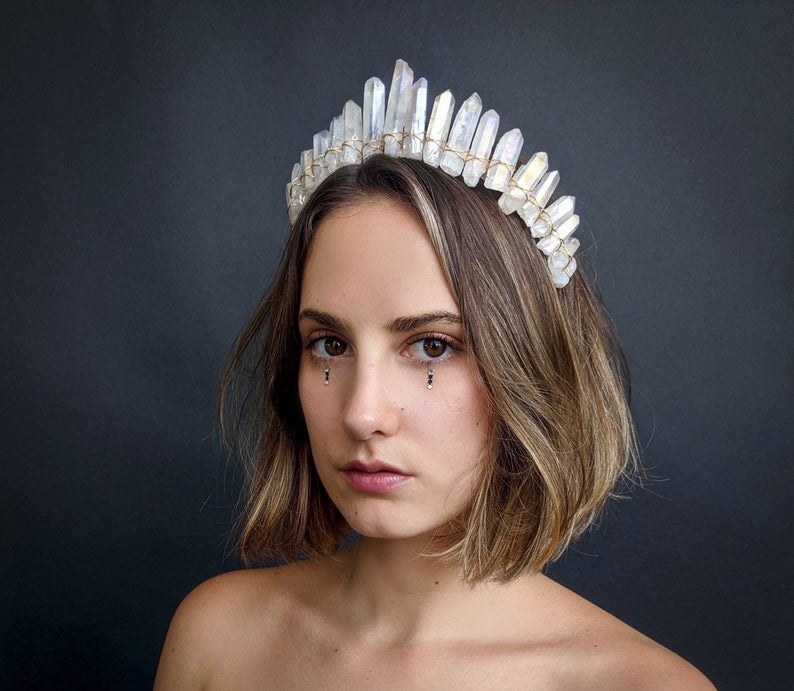 model wearing the clear and white crystal crown