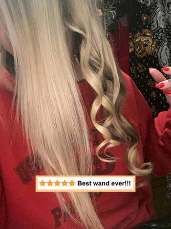 reviewer photo of a section of straight hair and another completely curled with wand