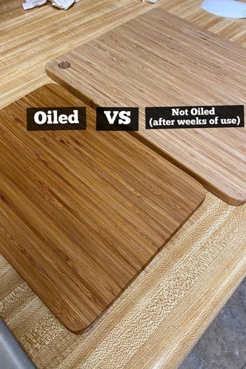 Reviewer's two identical cutting boards side-by-side, one oiled and dark and shiny, the other not oiled and pale 