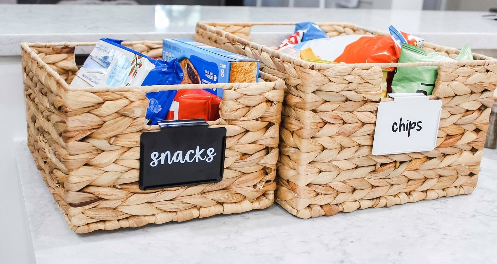 the custom vinyl labels clipped onto baskets one reads snacks and the other reads chips