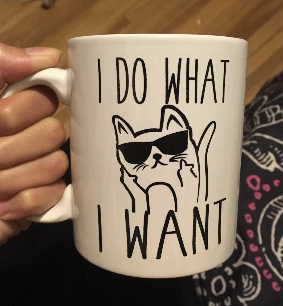 a white mug that says &quot;I do what I want&quot; with a drawing of a cat wearing sunglasses