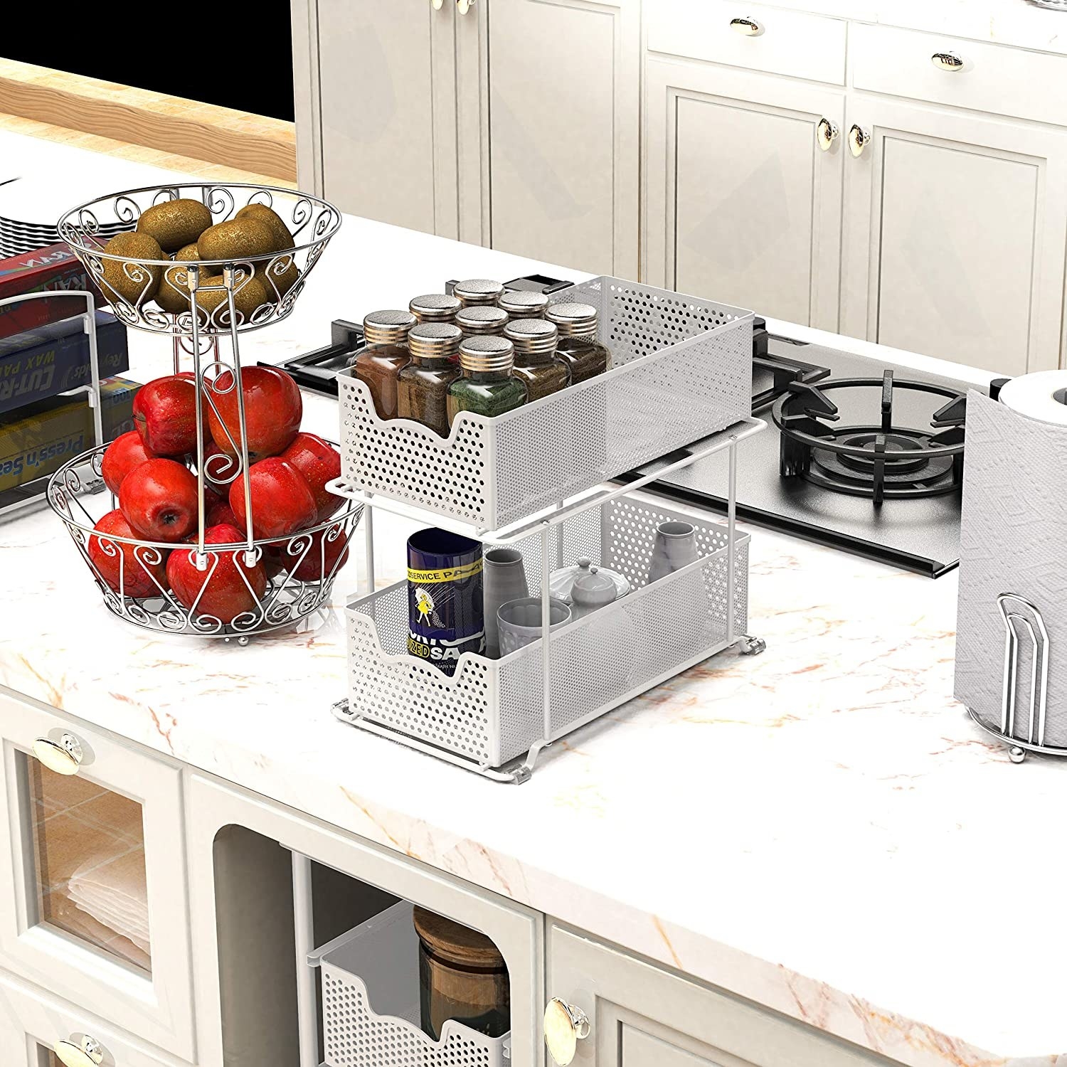 The two-tier set of drawers with spices and kitchen items inside 