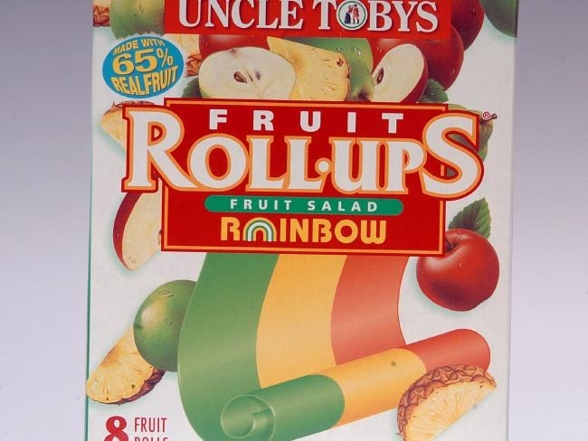 A packet of Fruit Roll Ups that reads &quot;fruit salad rainbow&quot; and &quot;made with 65% real fruit&quot;, featuring pictures of whole and sliced apples and pineapple