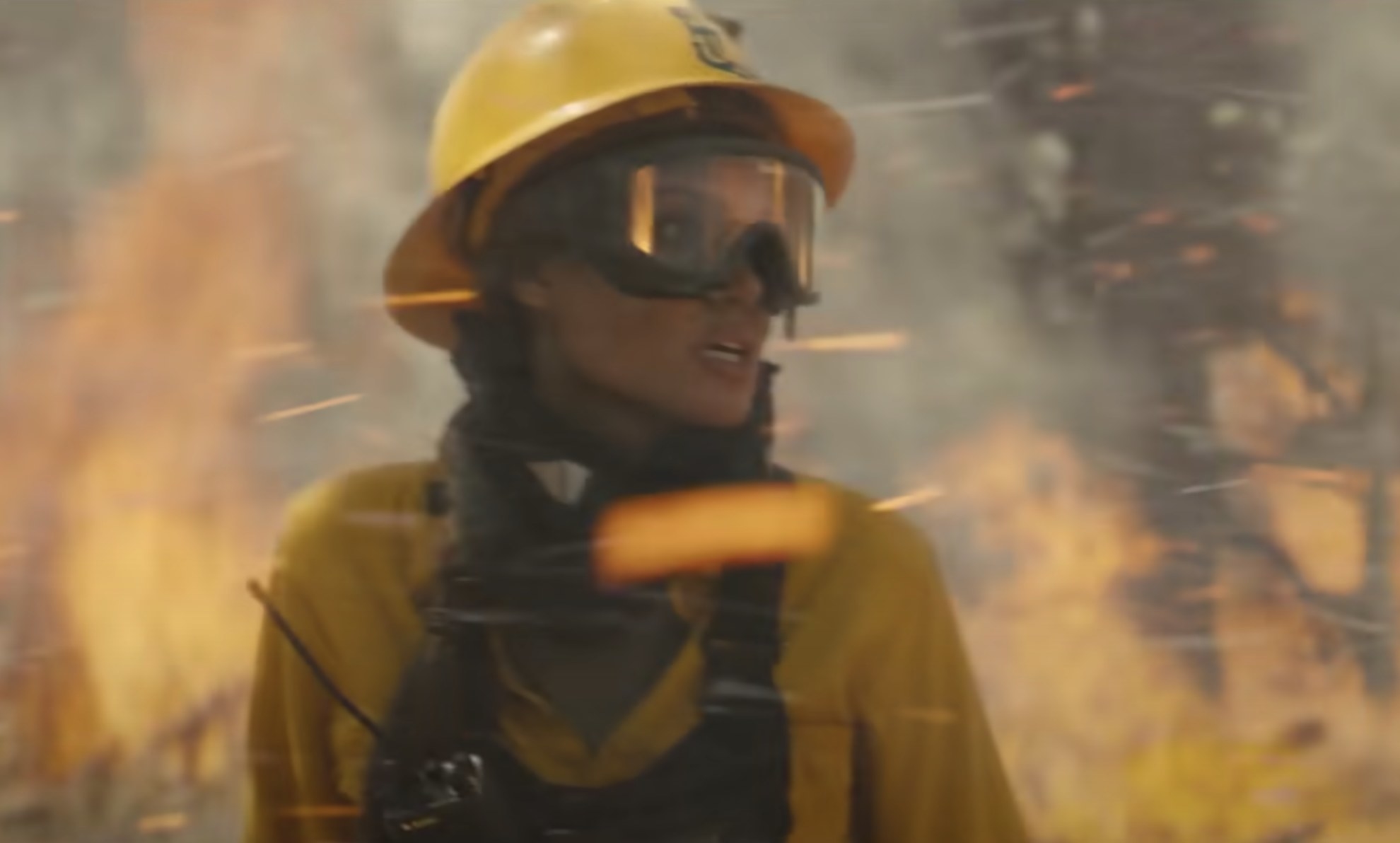 Angelina wears firefighter gear in the forest 