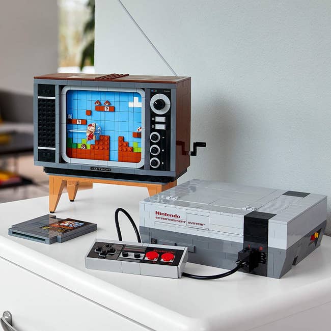 the lego NES system next to a lego tv and game cartridge