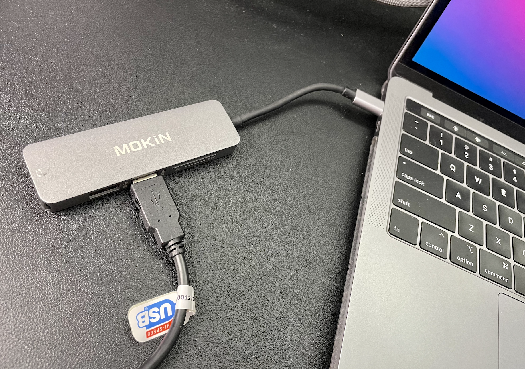 the adapter plugged into May's computer