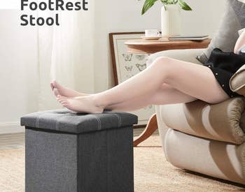 Model with feet resting on storage ottoman