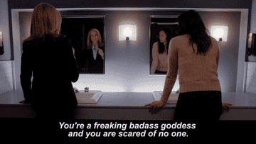 GIF of women giving pep talk in mirror and one is saying you&#x27;re a freaking badass goddess and you are scared of no on