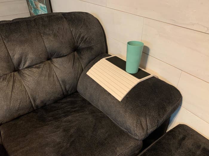 Couch table placed over arm rest