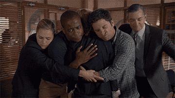 GIF of a group of friends hugging