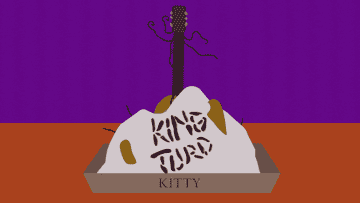 Litter box with a pile that says King Turd