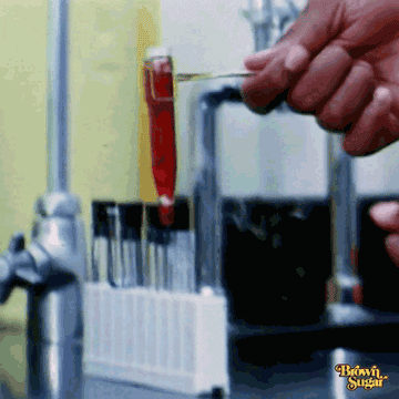 Pouring a test tube into a beaker