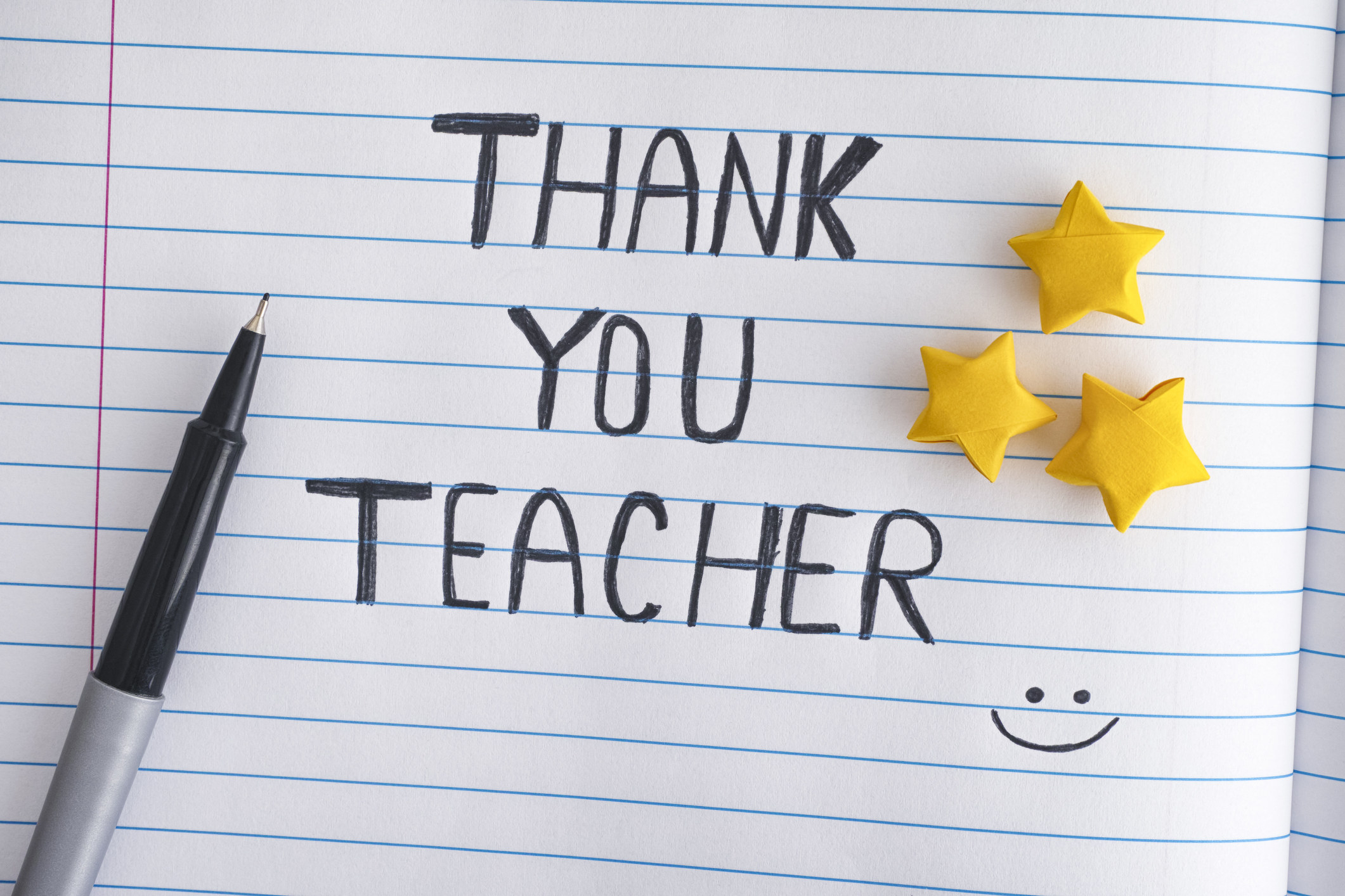 A lined piece of paper with a handwritten note that says, &quot;Thank you teacher&quot;