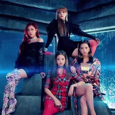 Blackpink sit on a throne in the music video for "ddu-du ddu-du"
