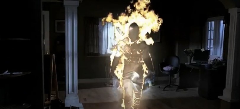 An apparition on fire inside a home
