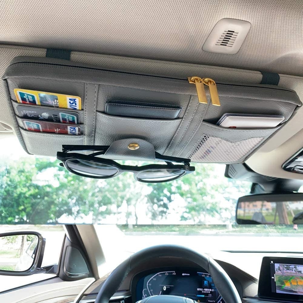 The pouch attached to a sun visor in a car