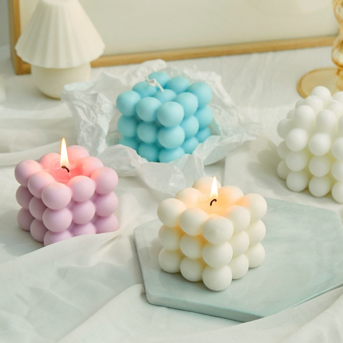 Four bubble candles on a table